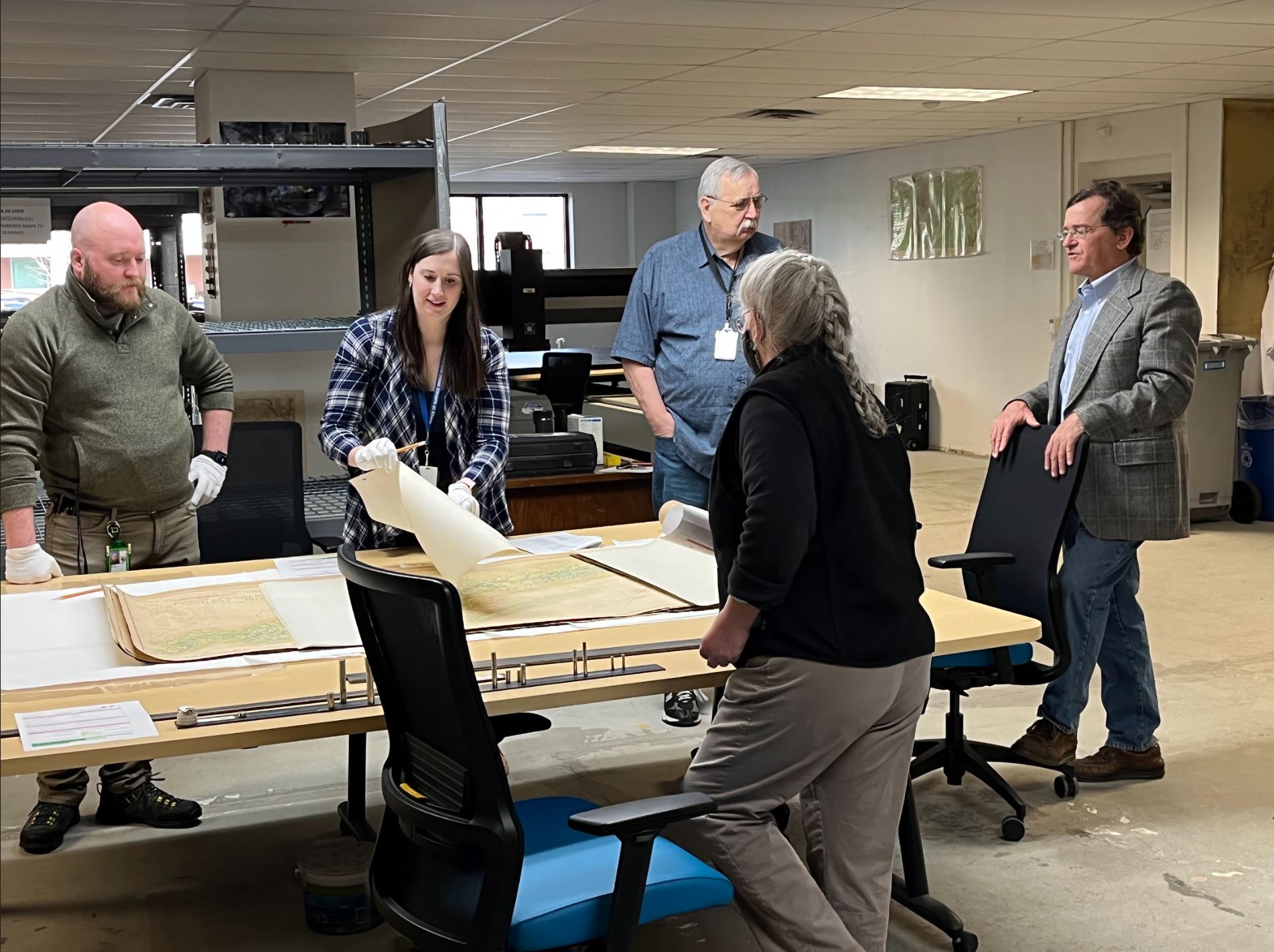 Chelsea Solotky, Harrison Kinzler and retired employee Paul Coyle meet with curators from Shenandoah National Park.