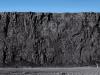 Tall ridge of grey colored rock.