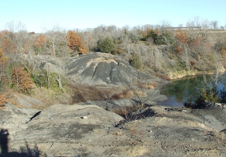 Funds are used for abandoned mine lands reclamation projects like this one in Mahaska County, Iowa, that mitigated dangerous highwalls and contaminated water problems. Photo courtesy of Iowa Abandoned Mine Land Program.