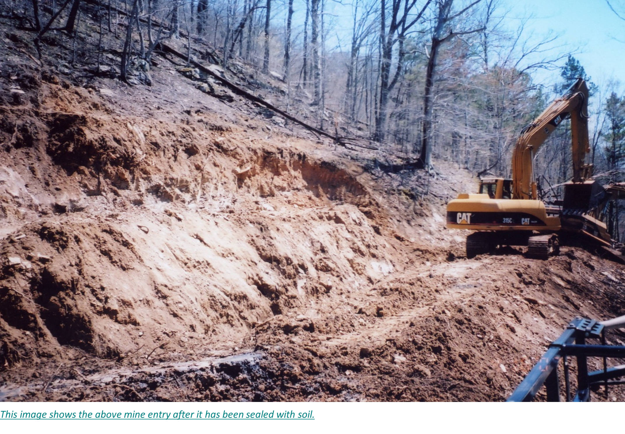 This image shows the above mine entry after it has been sealed with soil.