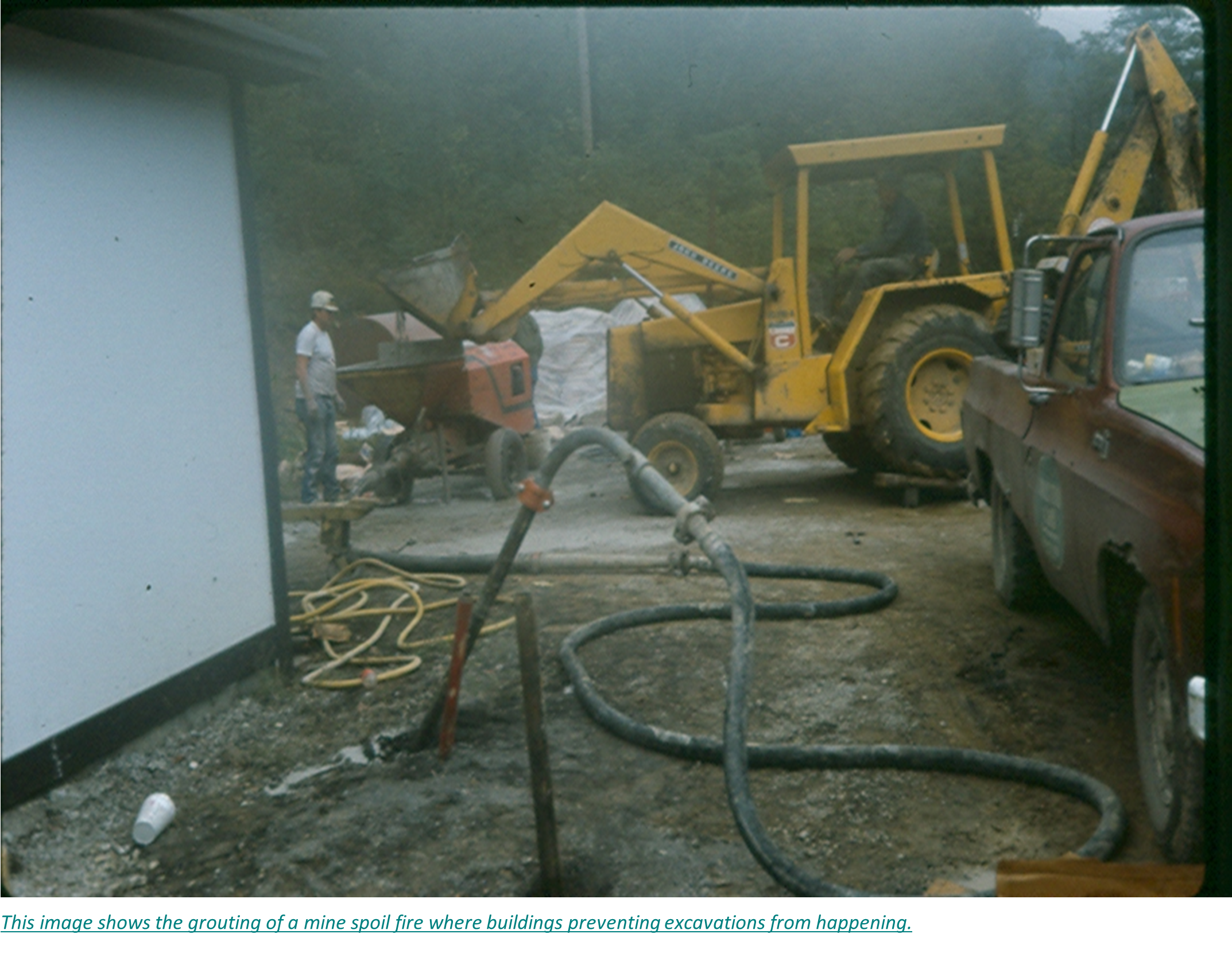 This image shows the grouting of a mine spoil fire where buildings preventing excavations from happening.