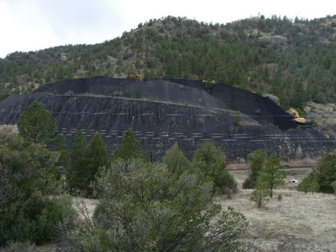 Funds are used for abandoned mine land reclamation projects similar to this one in Colfax County, New Mexico, where unstable coal piles were reclaimed and the water channel restored. Photo courtesy of New Mexico Abandoned Mine Land Program.