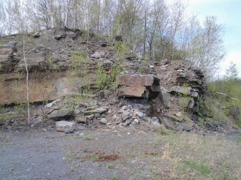 Rocky, unstable hillside under spring deciduous trees 